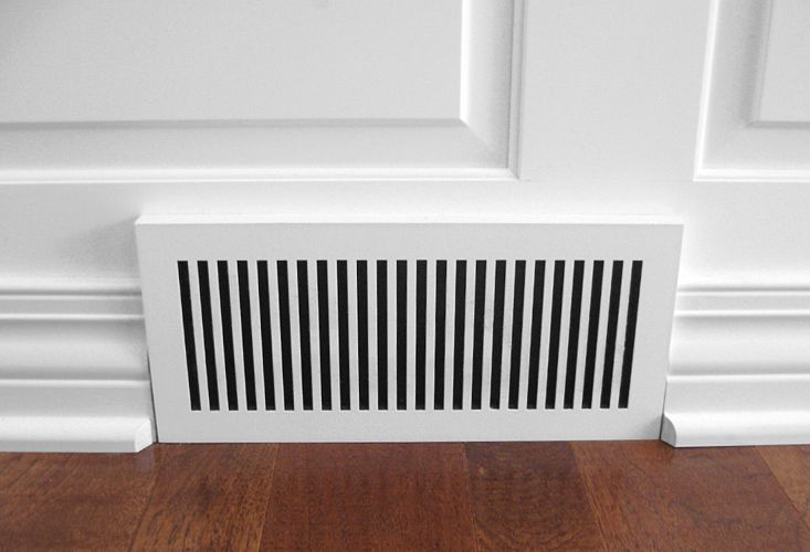 painted wood baseboard air vent